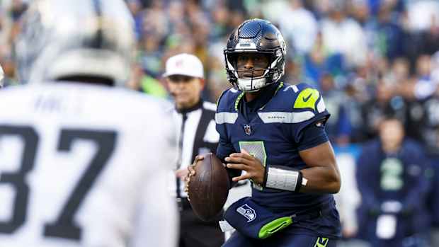 Nov 27, 2022; Seattle, Washington, USA; Seattle Seahawks quarterback Geno Smith (7) looks to pass against the Las Vegas Raiders during the first quarter at Lumen Field.